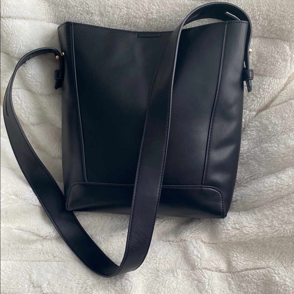 Black shoulder bag with removable zippered pouch